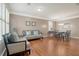 Cozy living room with hardwood floors, plantation shutters, and stylish furnishings for relaxing at 314 Sanctuary Park Dr, Summerville, SC 29486