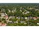 An aerial view shows the neighborhood surrounded by lush mature trees in a beautiful community at 316 Bridgetown Pass, Mount Pleasant, SC 29464