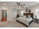 Bedroom with wood bed, ceiling fan, neutral walls and access to a private balcony at 316 Bridgetown Pass, Mount Pleasant, SC 29464