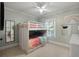 Bright bedroom with rainbow themed bunk beds, ceiling fan, and neutral walls at 316 Bridgetown Pass, Mount Pleasant, SC 29464