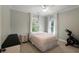 Cozy bedroom features natural light, neutral walls and carpet, ceiling fan and closet space at 316 Bridgetown Pass, Mount Pleasant, SC 29464