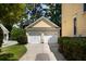 A two-car detached garage with carriage doors and a private driveway offers secure parking at 316 Bridgetown Pass, Mount Pleasant, SC 29464