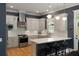 Modern kitchen with white cabinets, stainless steel appliances, and breakfast bar at 316 Bridgetown Pass, Mount Pleasant, SC 29464