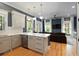 Open concept kitchen with white cabinets, quartz countertops, and stainless steel appliances at 316 Bridgetown Pass, Mount Pleasant, SC 29464