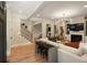 Bright living room with hardwood floors, fireplace, and staircase to the second floor at 316 Bridgetown Pass, Mount Pleasant, SC 29464