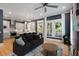 Open-concept living area with stainless steel appliances in the adjacent kitchen and recessed lights at 316 Bridgetown Pass, Mount Pleasant, SC 29464