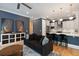 Modern interior with a comfortable sofa and an open view to the kitchen area at 316 Bridgetown Pass, Mount Pleasant, SC 29464