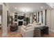 Spacious living room with fireplace, built-in shelves, modern lighting, and hardwood floors at 316 Bridgetown Pass, Mount Pleasant, SC 29464