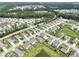 Aerial view of a residential area with pond and streets surrounded by lush greenery at 316 Knawl Rd, Moncks Corner, SC 29461