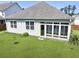 Aerial view of a home with a large, green backyard and sunroom at 316 Knawl Rd, Moncks Corner, SC 29461
