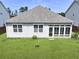 Aerial view of a home with a large, green backyard and sunroom at 316 Knawl Rd, Moncks Corner, SC 29461