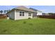 View of a spacious backyard with a well maintained lawn and wooden fence at 316 Knawl Rd, Moncks Corner, SC 29461