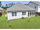 Aerial view of a home with a large, green backyard and sunroom at 316 Knawl Rd, Moncks Corner, SC 29461
