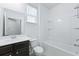 Bright bathroom featuring a tub-shower, dark wood vanity, and a large mirror at 316 Knawl Rd, Moncks Corner, SC 29461