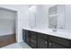 Bathroom with double sink vanity, tile floor, and walk-in closet entrance at 316 Knawl Rd, Moncks Corner, SC 29461