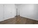 Unfurnished bedroom with wood floors and natural light from an open door at 316 Knawl Rd, Moncks Corner, SC 29461