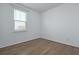 A bright, empty bedroom with hardwood floors and a large window at 316 Knawl Rd, Moncks Corner, SC 29461