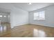 Bedroom with hardwood floors, a large window, and an open doorway at 316 Knawl Rd, Moncks Corner, SC 29461