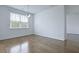 Bright dining room featuring hardwood floors, a modern chandelier, and a large window at 316 Knawl Rd, Moncks Corner, SC 29461