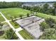 A top-down view of a dog park with grassy areas, trees, and benches at 316 Knawl Rd, Moncks Corner, SC 29461