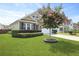 Beautifully landscaped front yard with a blooming tree and well-kept lawn at 316 Knawl Rd, Moncks Corner, SC 29461