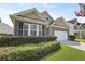 Charming brick-accented home with a well-maintained lawn and attached garage at 316 Knawl Rd, Moncks Corner, SC 29461