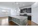 Open kitchen featuring a large center island, granite countertops, pendant lighting, and stainless steel appliances at 316 Knawl Rd, Moncks Corner, SC 29461
