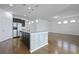 Open kitchen featuring a large center island, granite countertops, pendant lighting, and stainless steel appliances at 316 Knawl Rd, Moncks Corner, SC 29461
