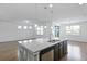 Bright, open kitchen with island, stainless steel appliances, pendant lights and lots of windows at 316 Knawl Rd, Moncks Corner, SC 29461
