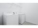 Laundry room featuring a white washer and dryer with wire shelving above at 316 Knawl Rd, Moncks Corner, SC 29461