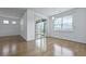 Spacious living room featuring hardwood floors, neutral walls, and sliding glass doors leading to outdoor at 316 Knawl Rd, Moncks Corner, SC 29461