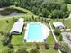 Aerial view of a community pool featuring lounge chairs, umbrellas and bath houses at 316 Knawl Rd, Moncks Corner, SC 29461