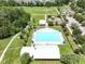 Aerial view of a pool in a park-like setting with mature trees and a playground nearby at 316 Knawl Rd, Moncks Corner, SC 29461