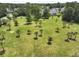 Aerial view of a recreation area with palm trees, grass, and mature landscaping at 316 Knawl Rd, Moncks Corner, SC 29461