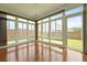 Bright sunroom with hardwood floors and multiple large windows at 316 Knawl Rd, Moncks Corner, SC 29461