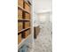 Updated bathroom features unique tile flooring, a modern vanity, and shelving unit for storage at 327 Mcclain St, Charleston, SC 29407