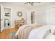 Bright bedroom with attached bathroom and closet boasts a ceiling fan and hardwood flooring at 327 Mcclain St, Charleston, SC 29407