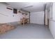 Spacious garage with a workbench, overhead lighting, painted floor and ample storage shelves at 327 Mcclain St, Charleston, SC 29407