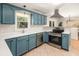 Updated kitchen boasts stainless steel appliances, bright white countertops, and tile flooring at 327 Mcclain St, Charleston, SC 29407