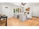 Comfortable living room with hardwood floors, white seating, and a view to the front porch at 327 Mcclain St, Charleston, SC 29407