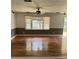 Bright living room with hardwood floors, large windows, and neutral-toned walls, offering ample natural light at 3307 Londonderry Rd, North Charleston, SC 29420