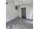 Bright living room featuring gray marble-like floors, a ceiling fan, and an open doorway at 3307 Londonderry Rd, North Charleston, SC 29420