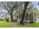 Expansive backyard featuring a patio, mature trees, and a well-maintained lawn at 3525 E Higgins Dr, Mount Pleasant, SC 29466