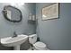 Charming powder room with vessel sink, decorative mirror and coastal-themed accents at 3525 E Higgins Dr, Mount Pleasant, SC 29466