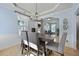 Formal dining room featuring a tray ceiling, chandelier, and access to other rooms at 3525 E Higgins Dr, Mount Pleasant, SC 29466