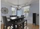 Dining area featuring seating for five, a decorative chandelier, and natural light at 3525 E Higgins Dr, Mount Pleasant, SC 29466