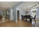 Spacious dining room with hardwood floors, a decorative chandelier, and adjacent living spaces at 3525 E Higgins Dr, Mount Pleasant, SC 29466