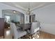 Bright dining room with views to other rooms and featuring a tray ceiling and chandelier at 3525 E Higgins Dr, Mount Pleasant, SC 29466