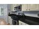 Kitchen featuring granite countertops, stainless steel appliances, and ample cabinet space at 3525 E Higgins Dr, Mount Pleasant, SC 29466