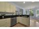 Kitchen featuring stainless steel appliances and a bar area with outside view through a window at 3525 E Higgins Dr, Mount Pleasant, SC 29466